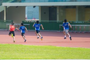 children running in a race on a sunny day
